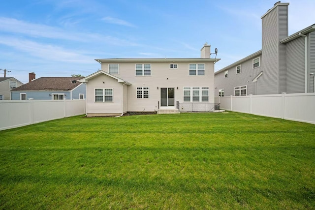1427 Bellmore Rd, North Bellmore, NY 11710 - rear view of property with entry steps and a chimney