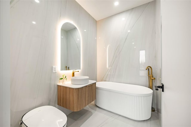 3116 21st St Unit Ph2B, Astoria, NY 11106 - full bath featuring a freestanding tub, vanity, and marble finish floors