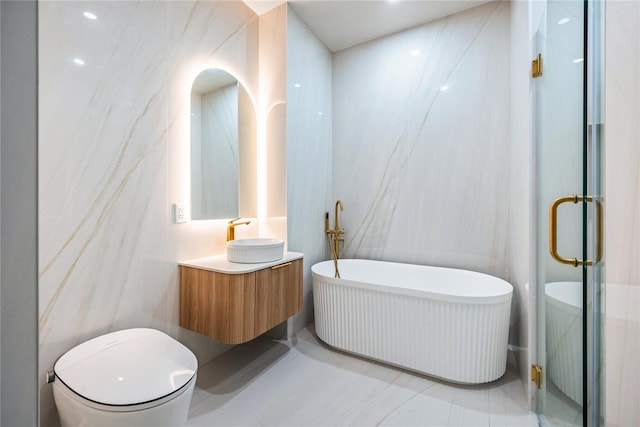 3116 21st St Unit Ph2B, Astoria, NY 11106 - full bathroom with vanity, a stall shower, a freestanding tub, toilet, and tile walls