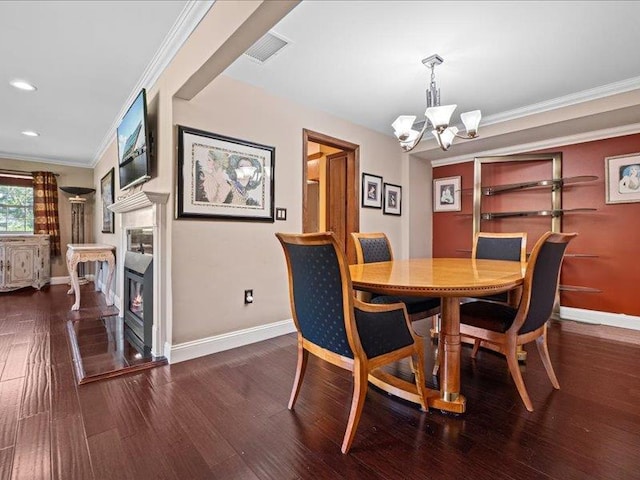 dining area with baseboards, a chandelier, wood finished floors, ornamental molding, and recessed lighting