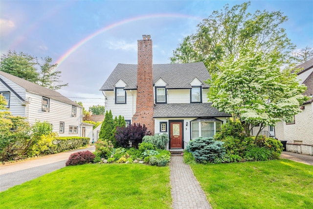 5 Cary Rd, Great Neck, NY 11021 - view of front of home featuring a chimney and a front lawn