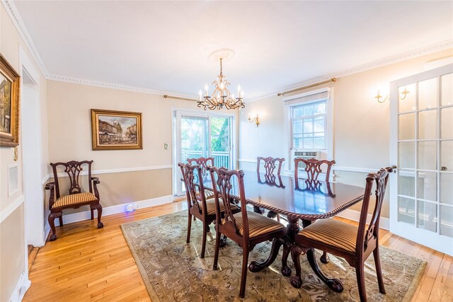 5 Cary Rd, Great Neck, NY 11021 - dining area with a chandelier, light wood-style flooring, plenty of natural light, and ornamental molding