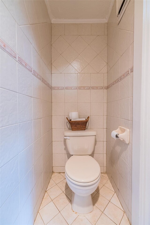 5 Cary Rd, Great Neck, NY 11021 - bathroom with crown molding, toilet, tile walls, and tile patterned floors