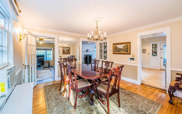 5 Cary Rd, Great Neck, NY 11021 - dining area with a chandelier, light wood finished floors, french doors, and crown molding