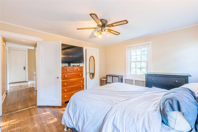 5 Cary Rd, Great Neck, NY 11021 - bedroom with radiator, hardwood / wood-style floors, ceiling fan, and crown molding