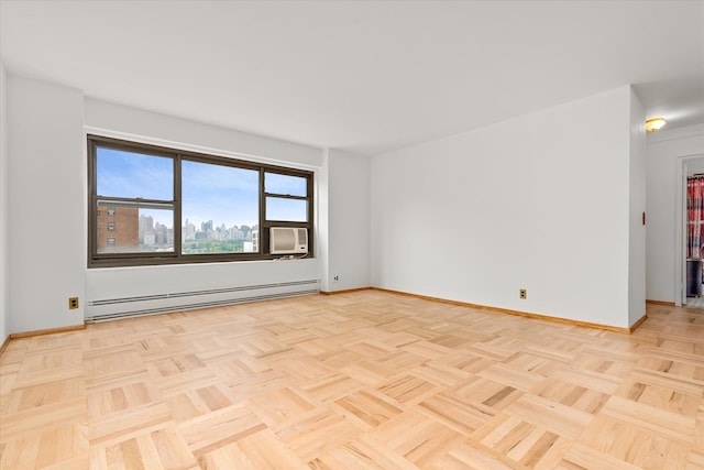 21-50 33rd Rd Unit 12Ab, Astoria, NY 11106 - empty room with a baseboard radiator, baseboards, and cooling unit