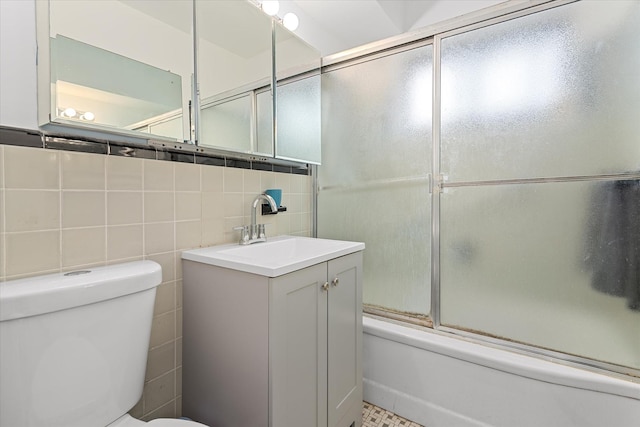 21-50 33rd Rd Unit 12Ab, Astoria, NY 11106 - bathroom featuring toilet, vanity, enclosed tub / shower combo, and tile walls
