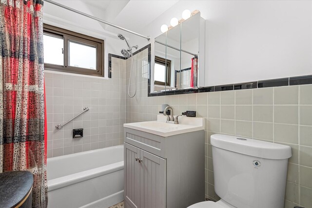 21-50 33rd Rd Unit 12Ab, Astoria, NY 11106 - full bath with toilet, plenty of natural light, shower / bath combination with curtain, tile walls, and vanity