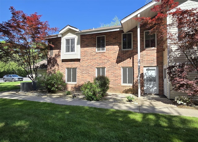 7 Laramie Ct Unit 7, Coram, NY 11727 - townhome / multi-family property with a front lawn and brick siding