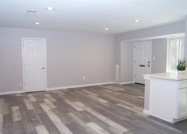 7 Laramie Ct Unit 7, Coram, NY 11727 - unfurnished room with dark wood-style floors, recessed lighting, and baseboards