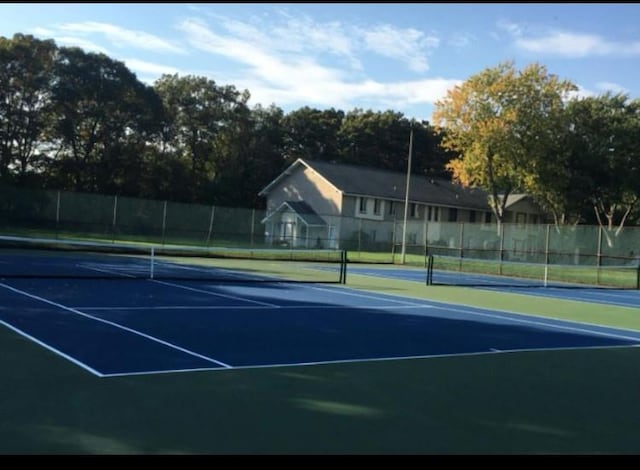 7 Laramie Ct Unit 7, Coram, NY 11727 - view of tennis court featuring fence