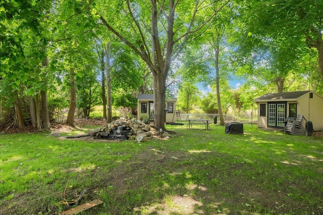 2 Moor Ln, East Patchogue, NY 11772 - view of yard with an outdoor structure and view of wooded area