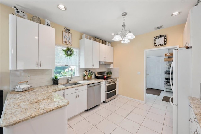 2 Moor Ln, East Patchogue, NY 11772 - kitchen with appliances with stainless steel finishes, a sink, decorative backsplash, under cabinet range hood, and white cabinets