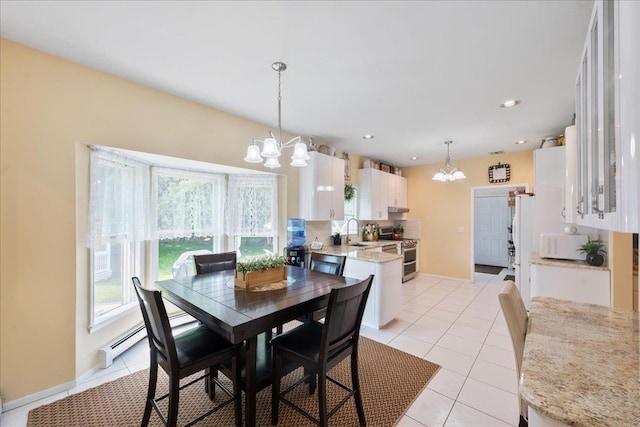 2 Moor Ln, East Patchogue, NY 11772 - dining space featuring a chandelier, light tile patterned floors, a baseboard radiator, recessed lighting, and baseboards