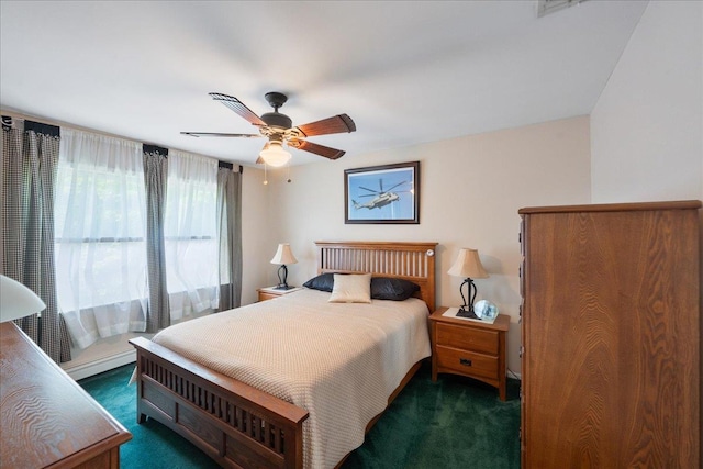 2 Moor Ln, East Patchogue, NY 11772 - bedroom with dark carpet and a ceiling fan