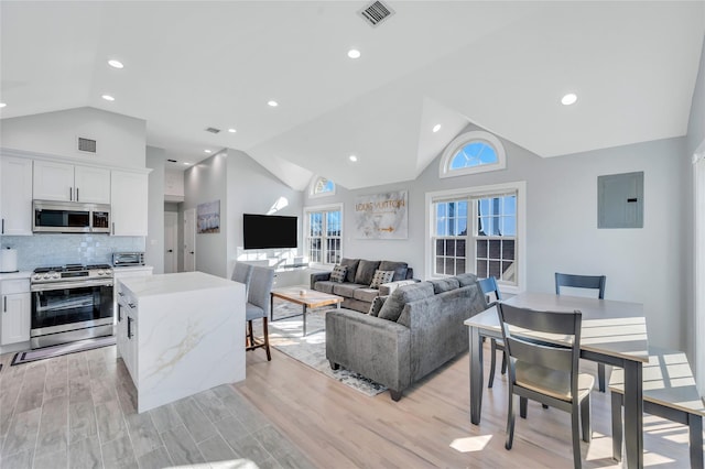 68 Brookline Ave, East Atlantic Beach, NY 11561 - living area featuring lofted ceiling, electric panel, light wood-style flooring, and recessed lighting