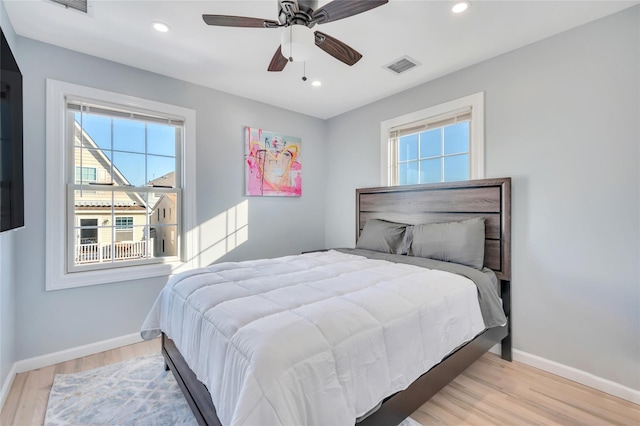 68 Brookline Ave, East Atlantic Beach, NY 11561 - bedroom featuring multiple windows, baseboards, wood finished floors, recessed lighting, and a ceiling fan