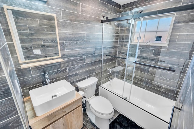 68 Brookline Ave, East Atlantic Beach, NY 11561 - full bath featuring toilet, shower / bath combination with glass door, vanity, and tile walls