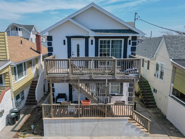 68 Brookline Ave, East Atlantic Beach, NY 11561 - view of front facade with stairway, a patio, and a deck