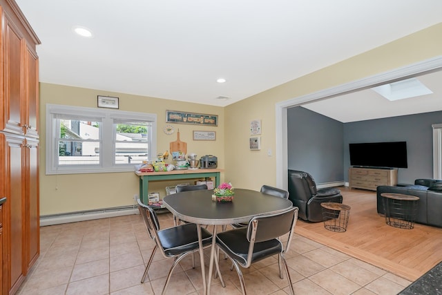 1450 Tadmor St, Merrick, NY 11566 - dining room with baseboard heating, light tile patterned floors, and recessed lighting