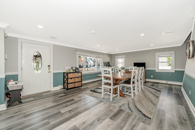 1450 Tadmor St, Merrick, NY 11566 - dining room with wood finished floors, baseboards, recessed lighting, and ornamental molding