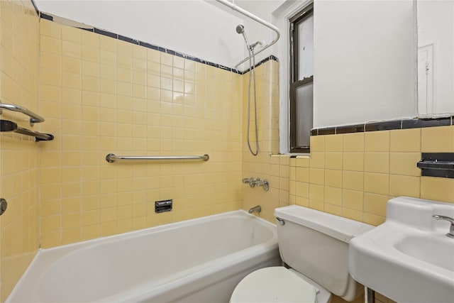 398 Oliver Pl Unit 1A, Bronx, NY 10458 - bathroom featuring toilet, shower / bathtub combination, tile walls, and a sink