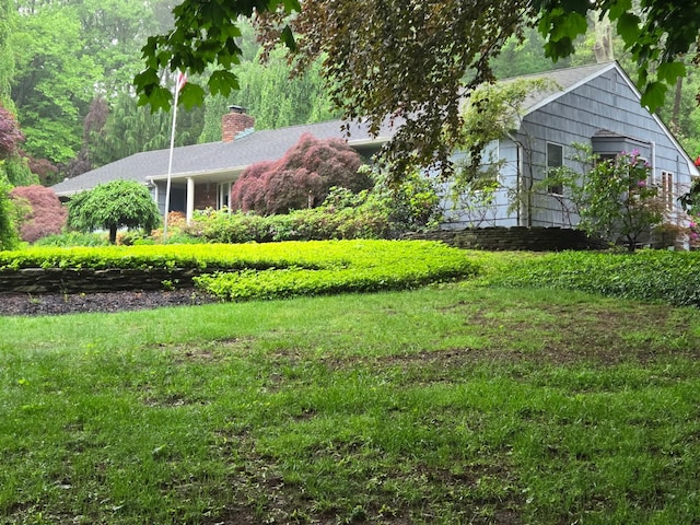 27 Fieldview Dr, Northport, NY 11768 - view of front of property with a chimney