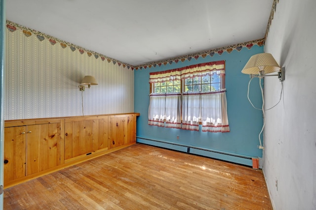 34 Leeside Dr, Carmel, NY 10512 - empty room with baseboard heating, wood finished floors, and wallpapered walls