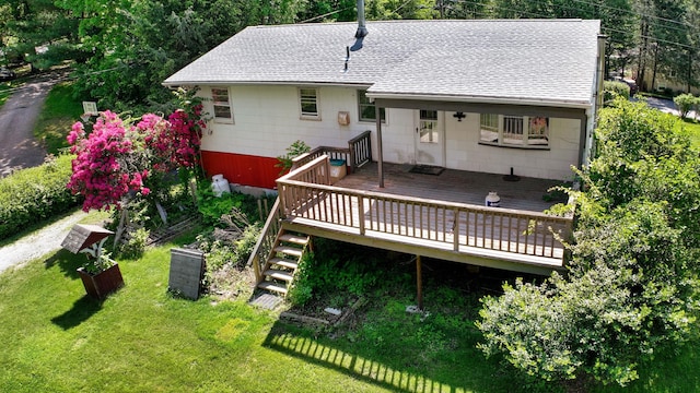 34 Leeside Dr, Carmel, NY 10512 - back of property with a shingled roof, a yard, a wooden deck, and stairs