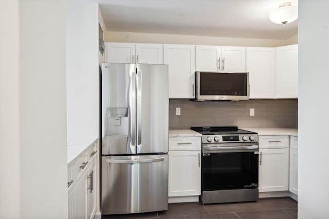 10-11 162nd St Unit 4A, Beechhurst, NY 11357 - kitchen with stainless steel appliances, white cabinets, and backsplash