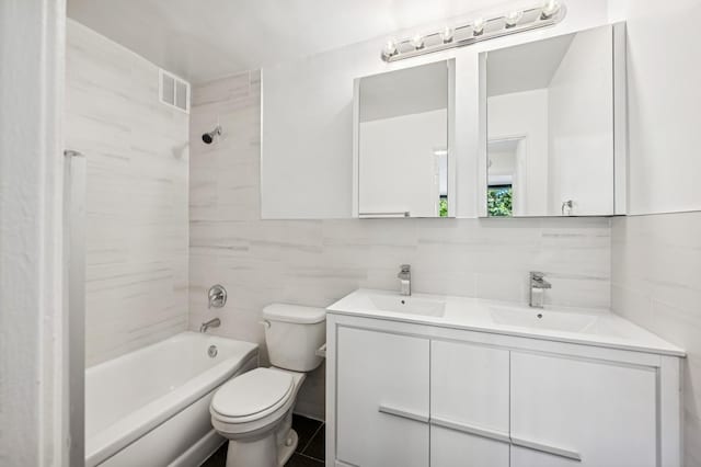 10-11 162nd St Unit 4A, Beechhurst, NY 11357 - bathroom featuring double vanity, toilet, shower / bath combination, tile walls, and backsplash