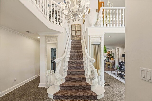 10 Bulaire, East Rockaway, NY 11518 - stairs with ornamental molding, a chandelier, a towering ceiling, and baseboards