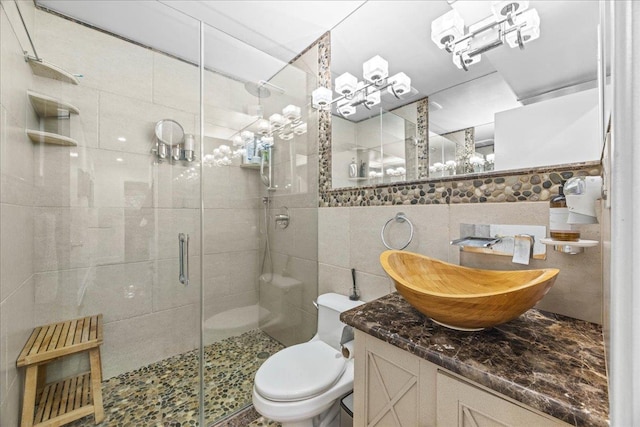 10 Bulaire, East Rockaway, NY 11518 - bathroom with tile walls, a stall shower, vanity, and toilet