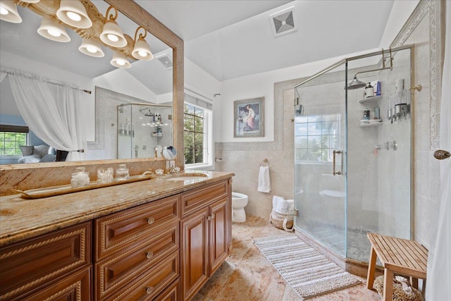 10 Bulaire, East Rockaway, NY 11518 - bathroom with plenty of natural light, vanity, toilet, a stall shower, and tile walls