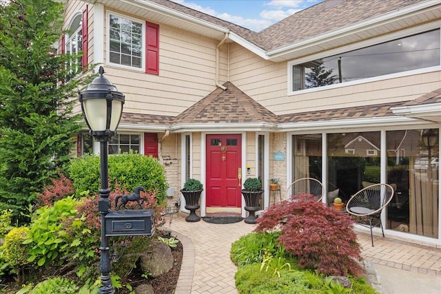 10 Bulaire, East Rockaway, NY 11518 - view of front of property with roof with shingles