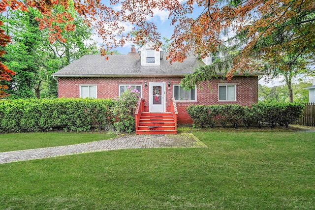 1817 Lincoln Ave, Holbrook, NY 11741 - cape cod house featuring brick siding, a chimney, and a shingled roof