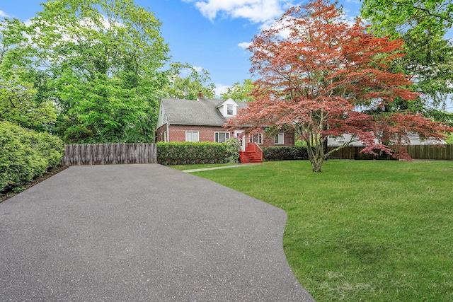 1817 Lincoln Ave, Holbrook, NY 11741 - view of front of house featuring a chimney and brick siding