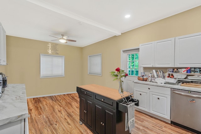 1817 Lincoln Ave, Holbrook, NY 11741 - kitchen with stainless steel dishwasher, white cabinetry, light countertops, a ceiling fan, and beamed ceiling