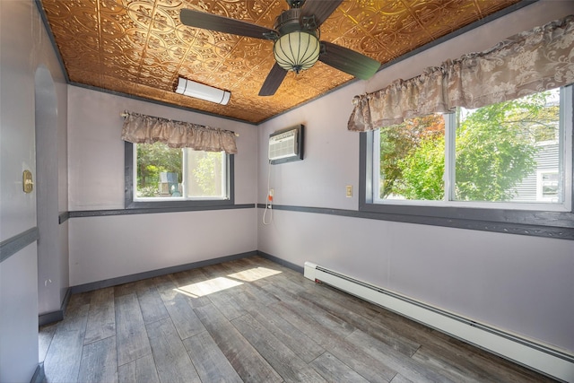 13 Cedar Ln, Poughkeepsie, NY 12601 - unfurnished room featuring a baseboard radiator, an ornate ceiling, ceiling fan, a wall mounted air conditioner, and wood finished floors