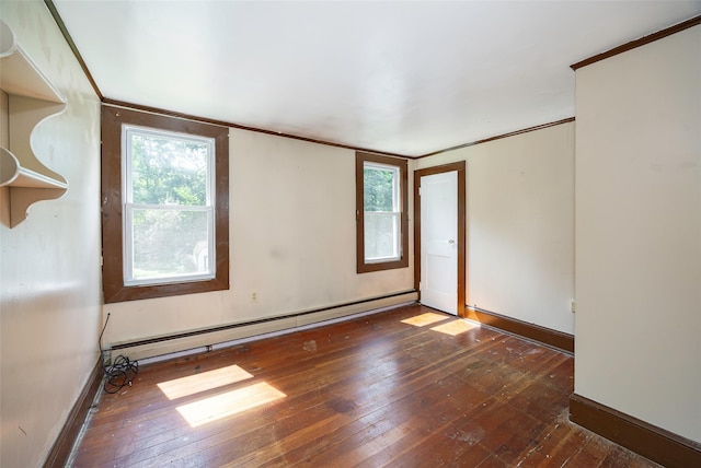 13 Cedar Ln, Poughkeepsie, NY 12601 - empty room featuring a baseboard heating unit, hardwood / wood-style floors, and crown molding