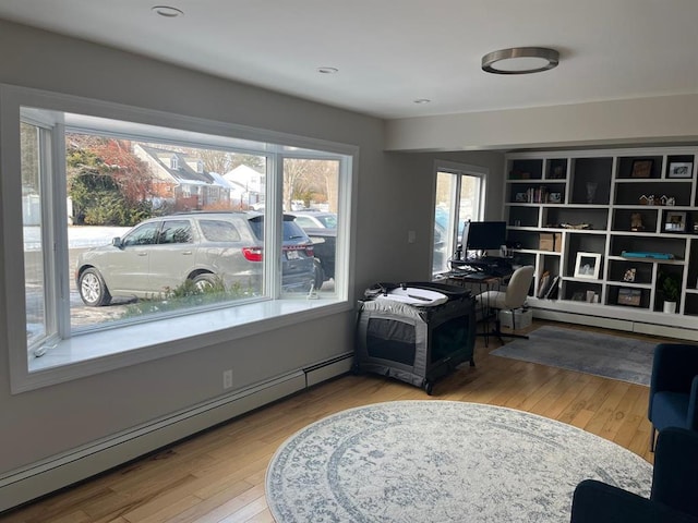 14 Cornfield Ln, Commack, NY 11725 - home office with a baseboard radiator and hardwood / wood-style flooring