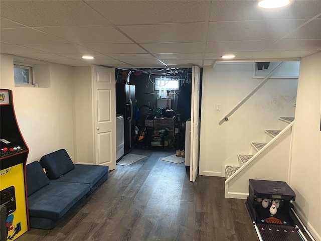 14 Cornfield Ln, Commack, NY 11725 - basement with stairway, dark wood-style floors, a paneled ceiling, and baseboards
