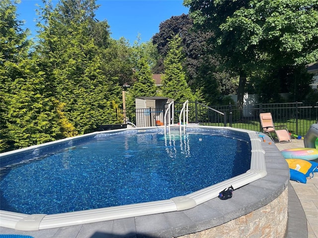 14 Cornfield Ln, Commack, NY 11725 - view of pool featuring fence and an outbuilding