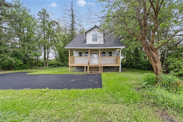 809 Broadway Unit 9W, Ulster Park, NY 12487 - cape cod house with covered porch and a front yard