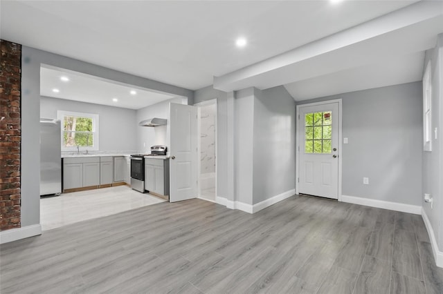 809 Broadway Unit 9W, Ulster Park, NY 12487 - unfurnished living room with baseboards, light wood-style floors, recessed lighting, and a sink