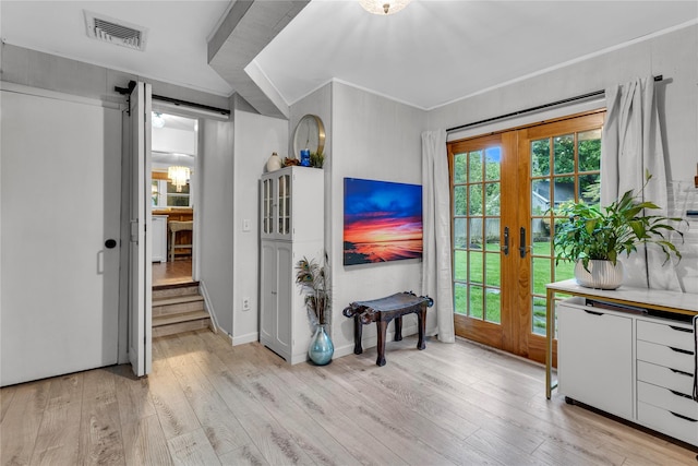 123 Maple Ave, Northport, NY 11768 - living room with crown molding, light wood finished floors, french doors, and baseboards