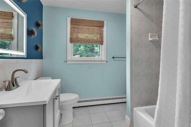 123 Maple Ave, Northport, NY 11768 - bathroom featuring a baseboard heating unit, tile patterned flooring, vanity, toilet, and tile walls