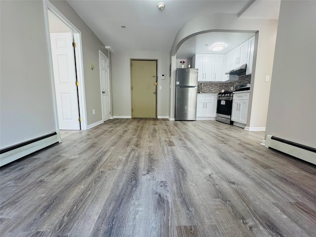 132-49 41st Rd Unit 2A, Flushing, NY 11355 - unfurnished living room with light wood-style floors, baseboard heating, and baseboards