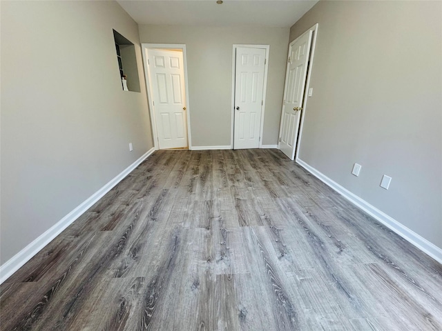 132-49 41st Rd Unit 2A, Flushing, NY 11355 - spare room featuring wood finished floors and baseboards