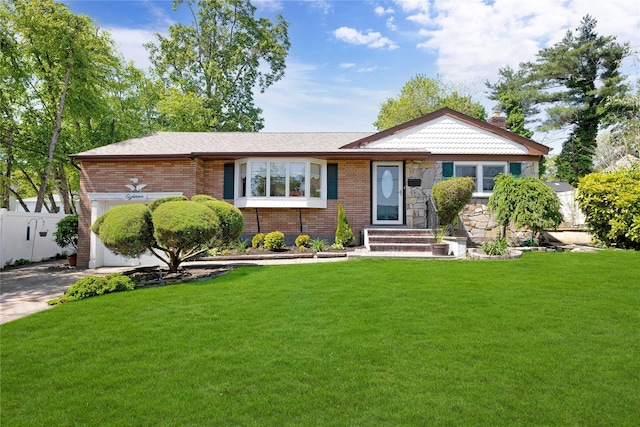 18 Hamilton St, Farmingdale, NY 11735 - view of front of property with brick siding, an attached garage, a front lawn, and a chimney
